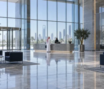 public-liability-insurance Visitor speaking to a receptionist in a commercial lobby for public liability insurance
